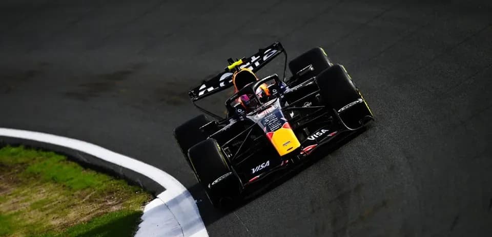 Formula 1 car navigating a track corner