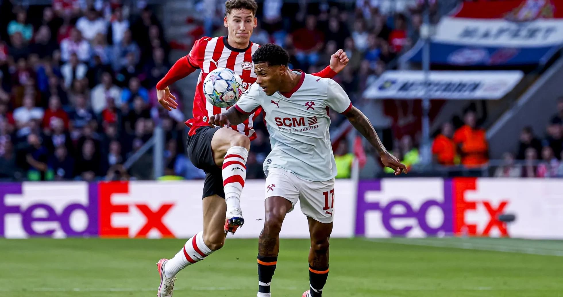 Two players contesting the ball during a match