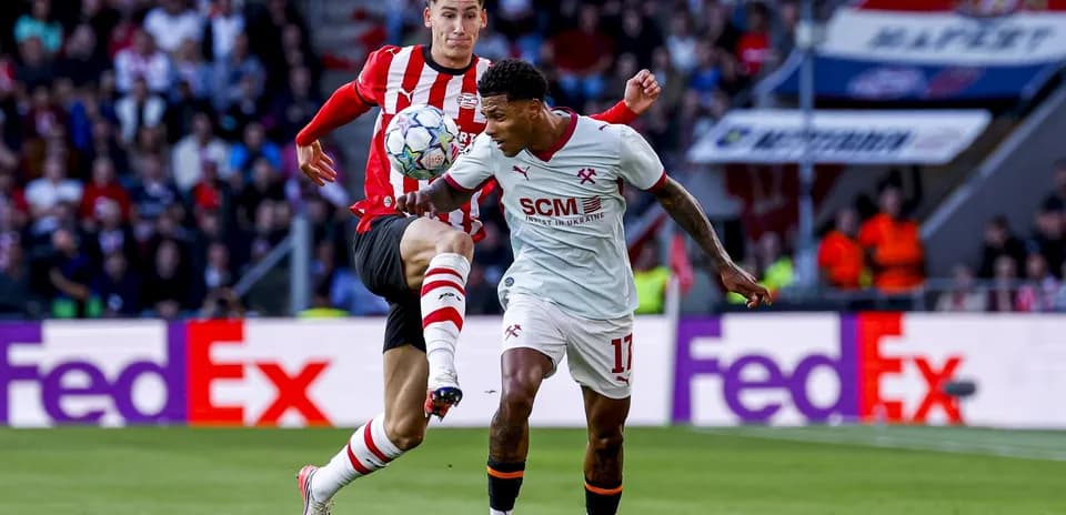Two players contesting the ball during a match