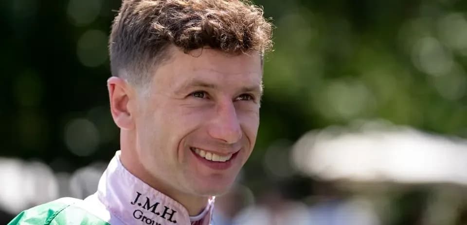 Jockey smiling before a horse race event