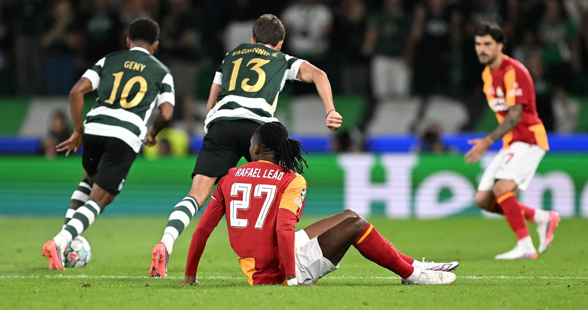 Rafael Leão sitting on the pitch during match