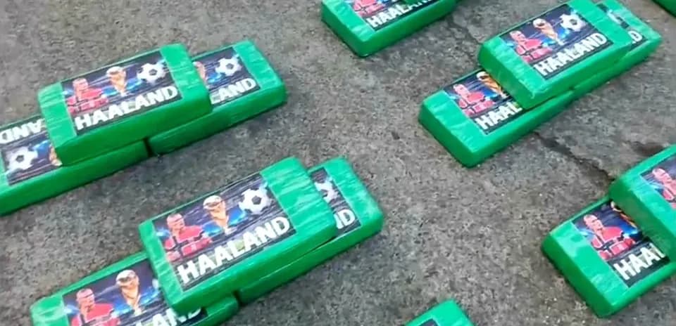 Green blocks with 'Haaland' branding on pavement