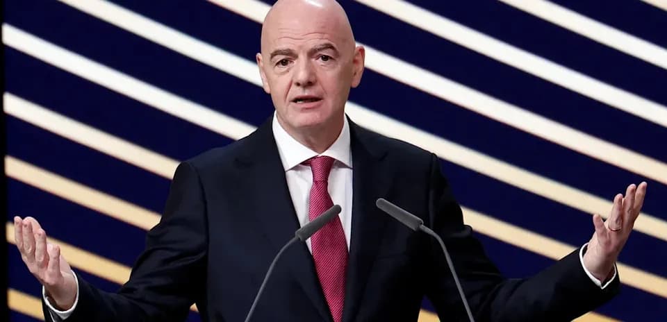 FIFA president speaking at press conference podium