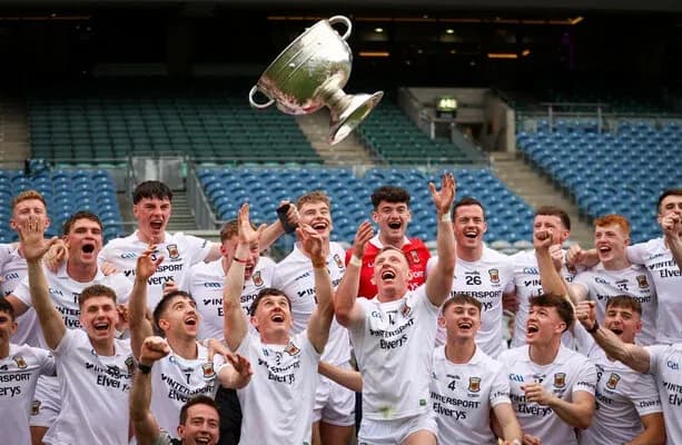 Jubilation of players holding trophy in celebration