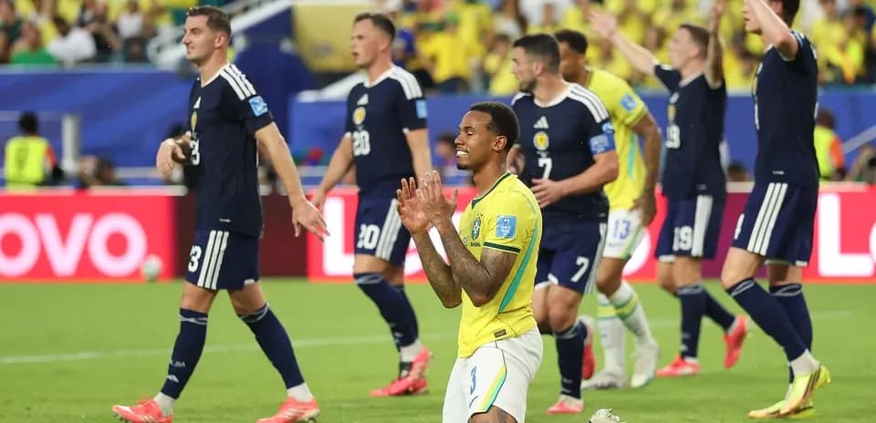Brazilian player kneeling during match against Scotland