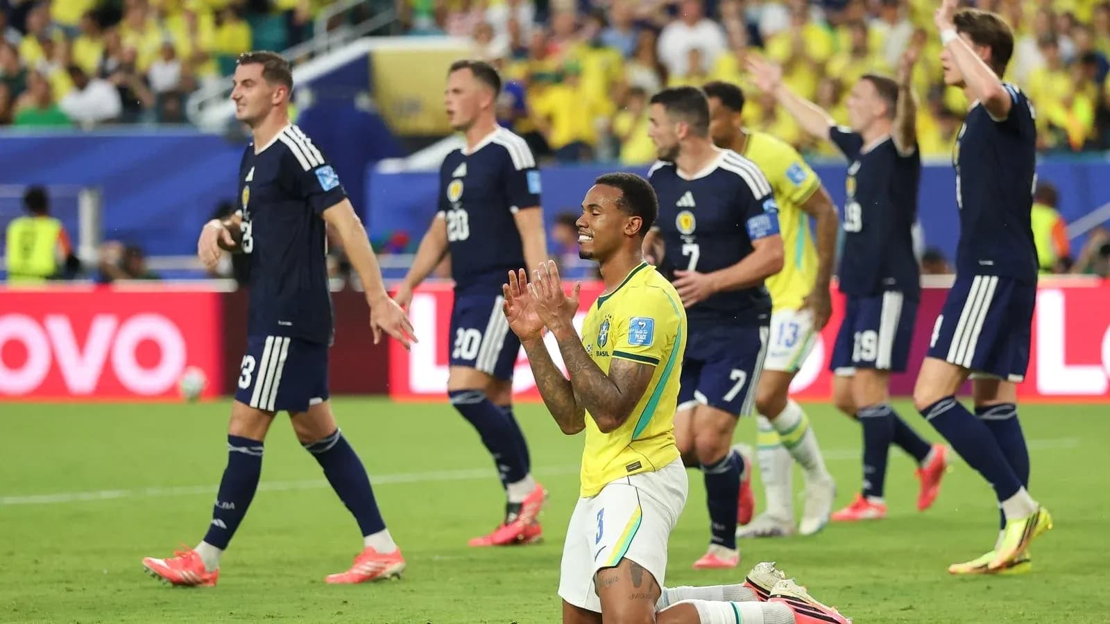 Brazilian player kneeling during match against Scotland