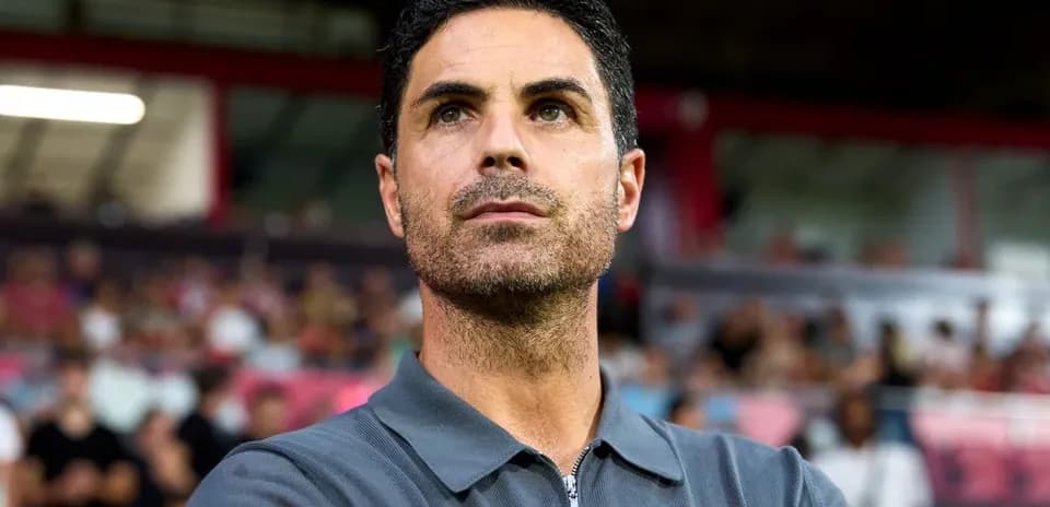 Football coach observing match from sidelines