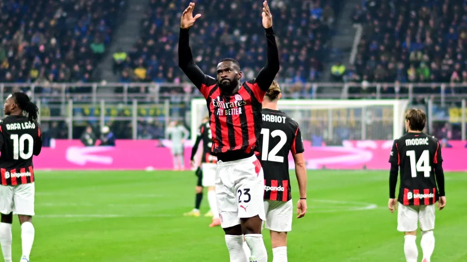 AC Milan players celebrating during a match