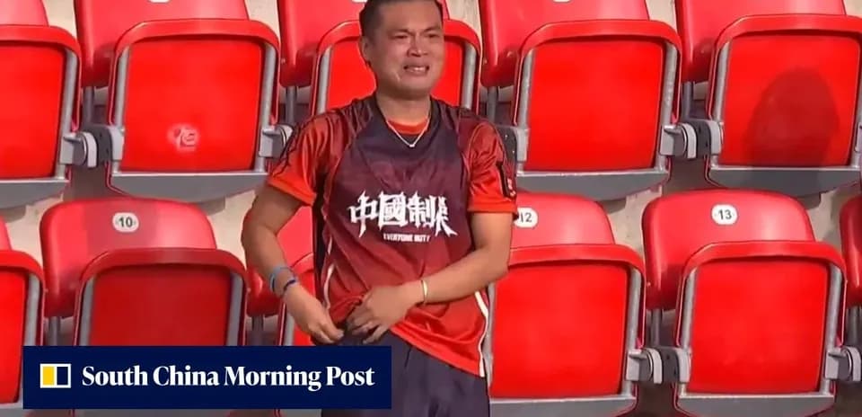 Fan wearing jersey in empty stadium seats