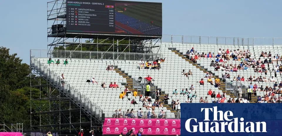 Stadium seating with large screen displaying race results