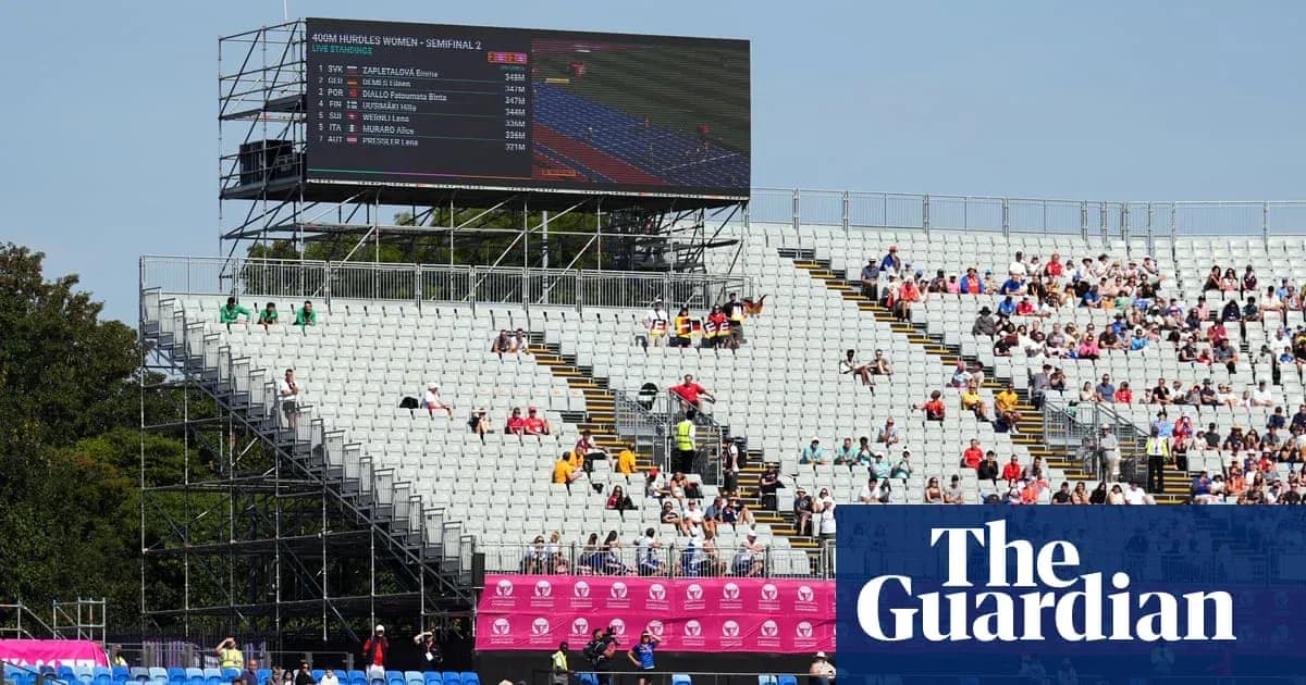 Stadium seating with large screen displaying race results