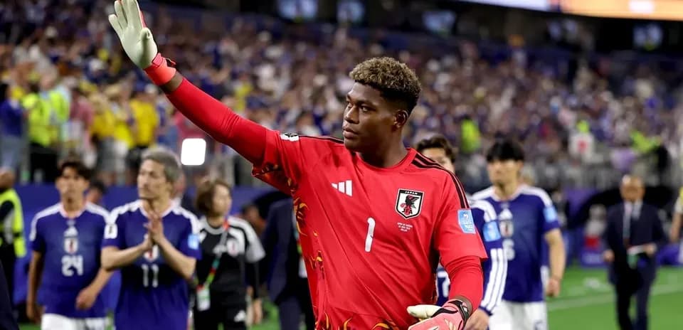 Goalkeeper waving after match with teammates