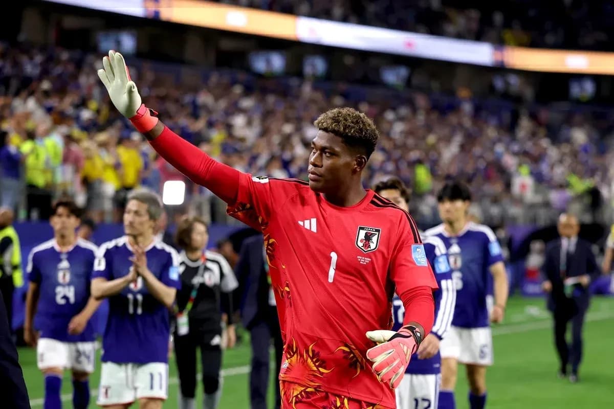 Goalkeeper waving after match with teammates