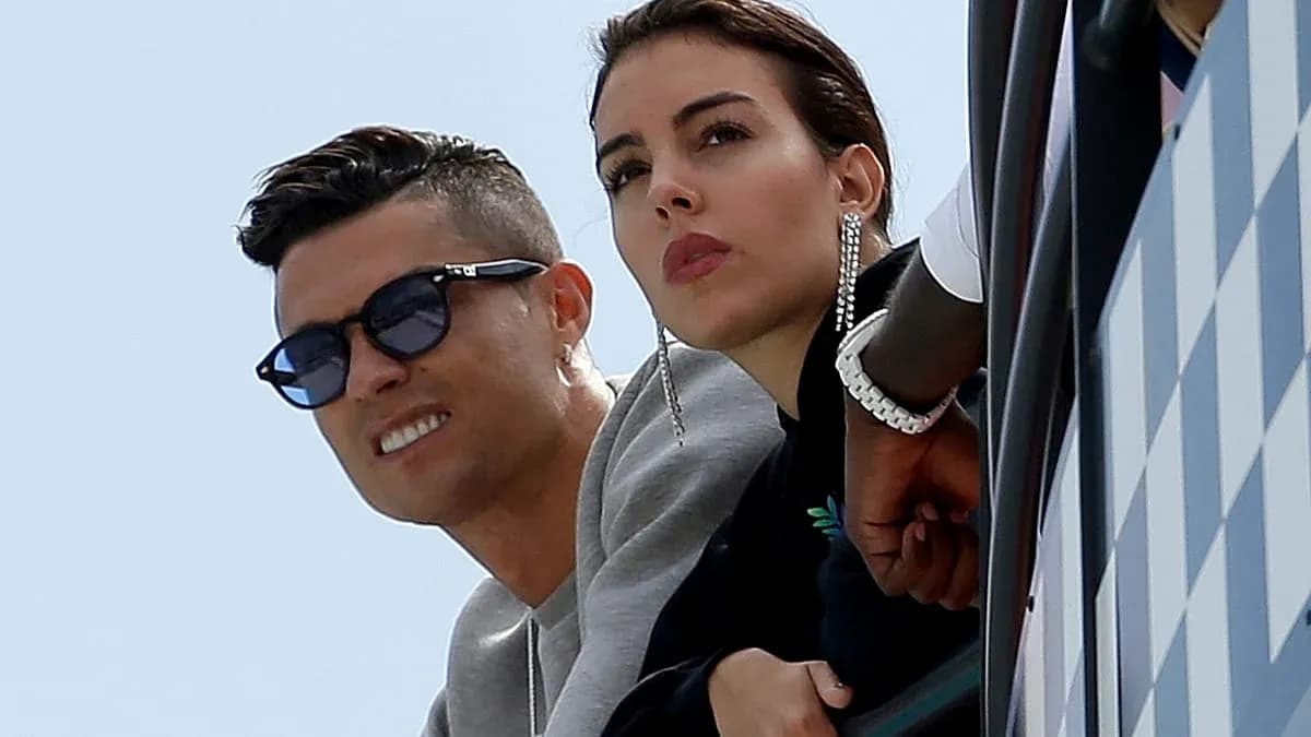 Two individuals observing from a balcony