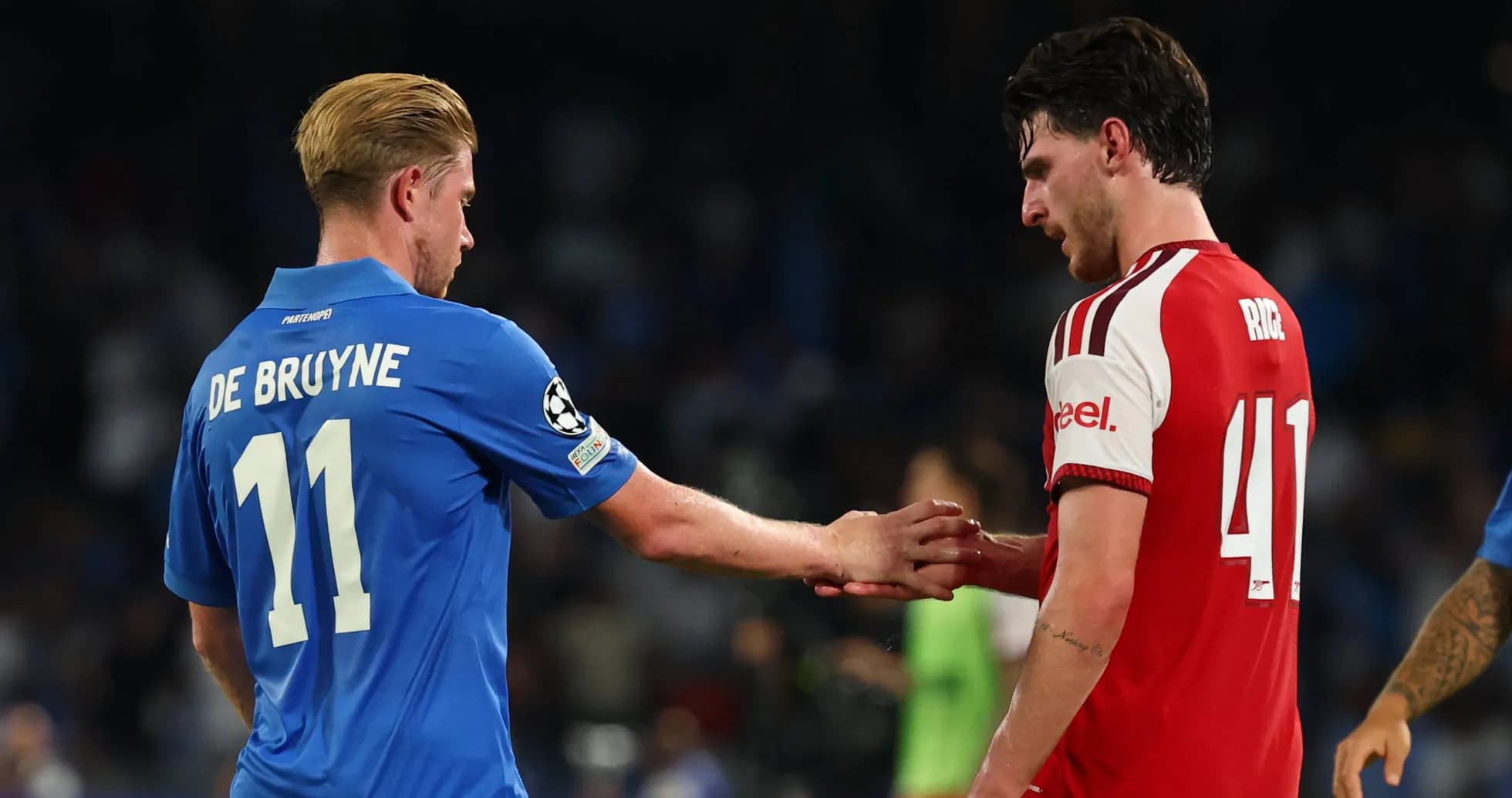 De Bruyne and Rice shaking hands on field