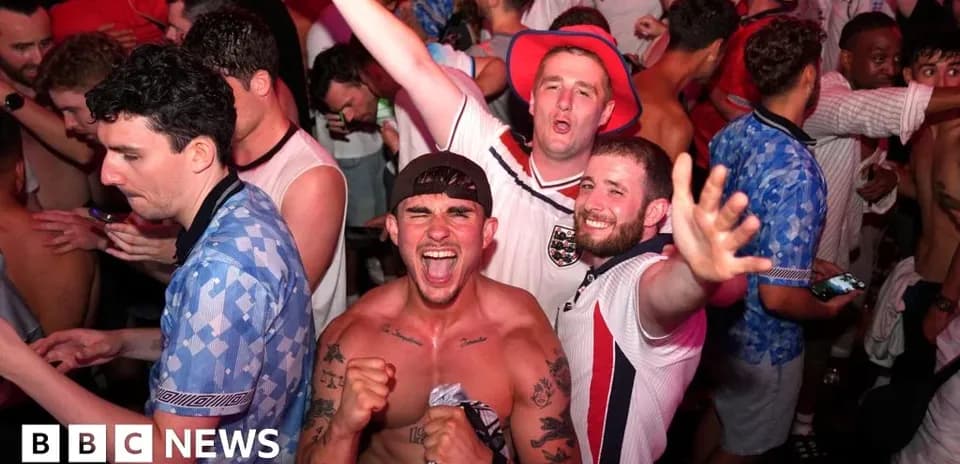 Fans celebrating in a crowded venue