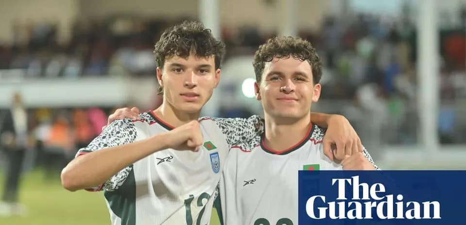 Two football players celebrating after a match