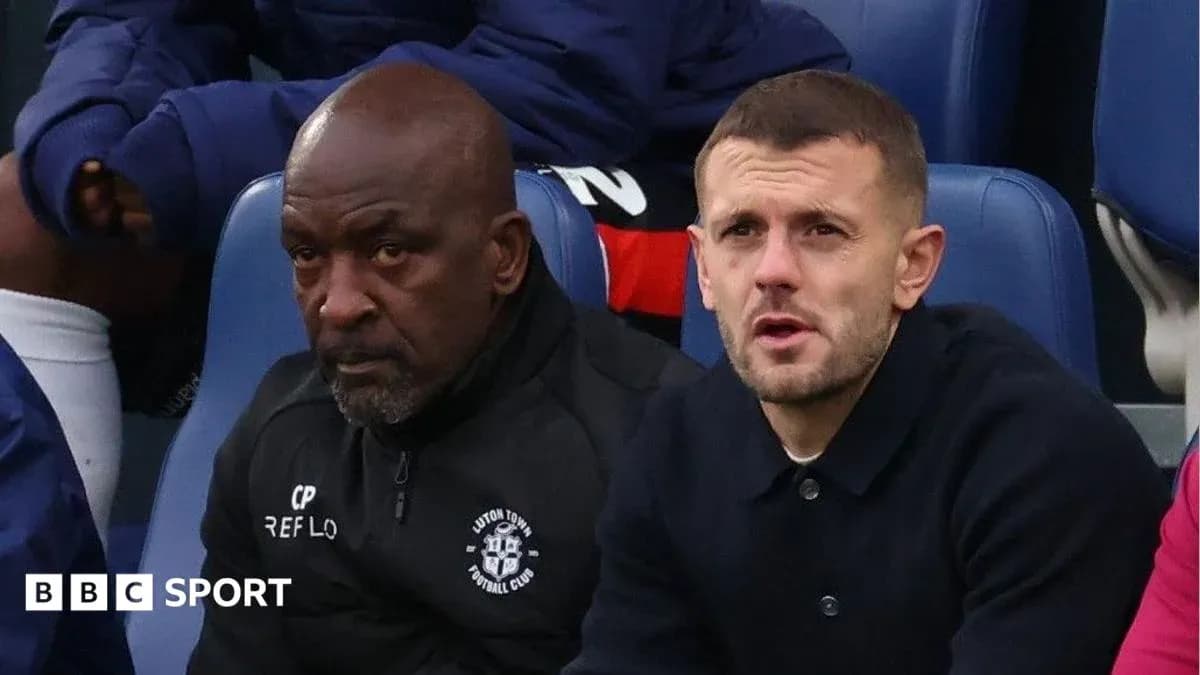 Luton Town staff sitting on the bench during match