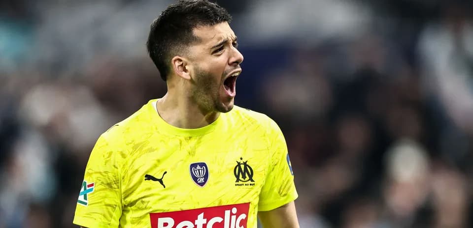Goalkeeper in yellow jersey celebrating during match