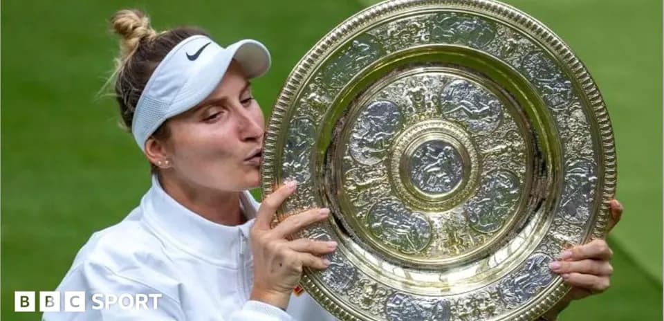 Tennis player kissing trophy after winning championship