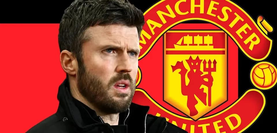 Men's football coach in front of Manchester United logo
