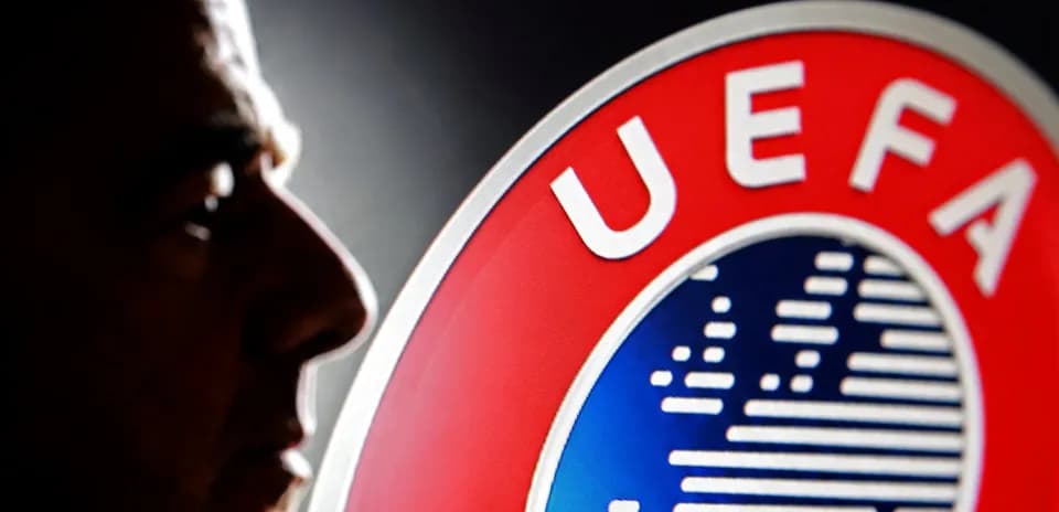 Silhouette of a person next to UEFA logo