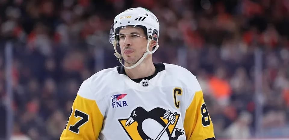 Hockey player in Penguins jersey during game