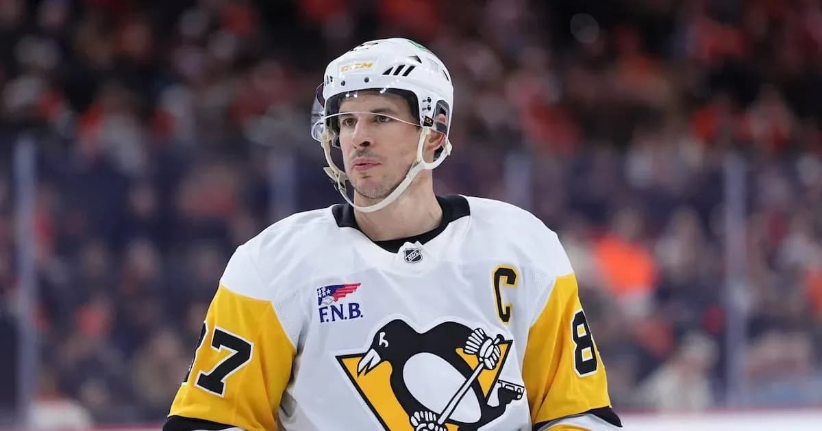 Hockey player in Penguins jersey during game