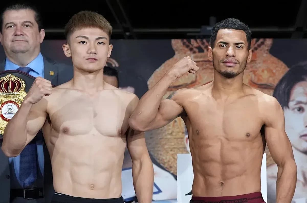 Two boxers posing for weigh-in before match
