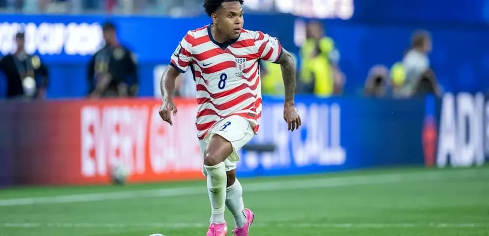 US player dribbling ball during match action