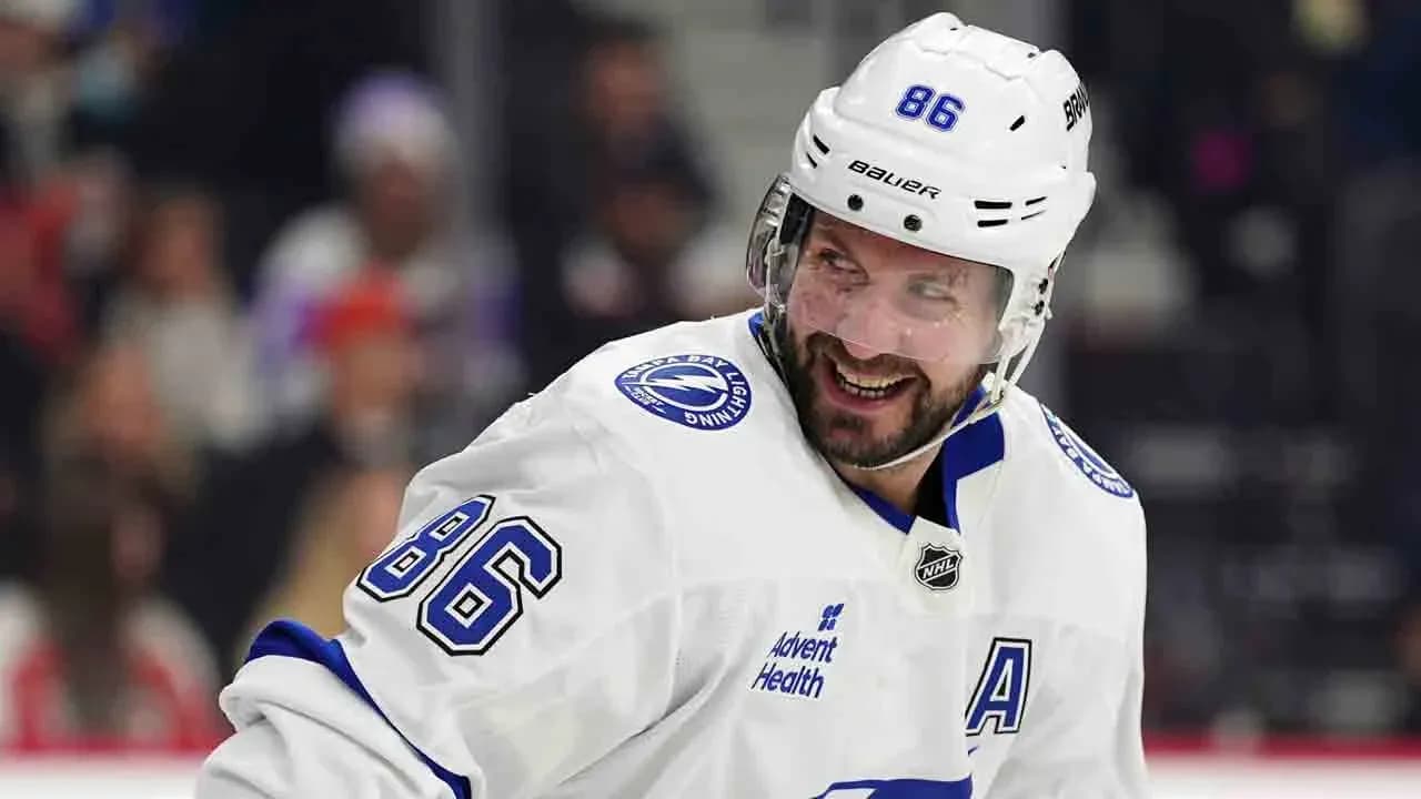 Hockey player smiling during game in white jersey