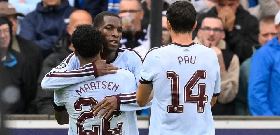 Players celebrating a goal on the pitch