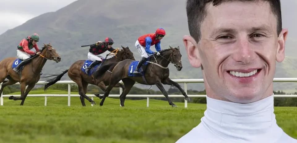 Jockeys racing on horses at the racetrack