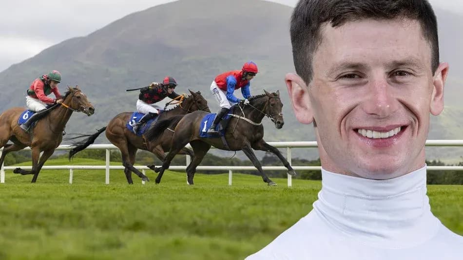 Jockeys racing on horses at the racetrack