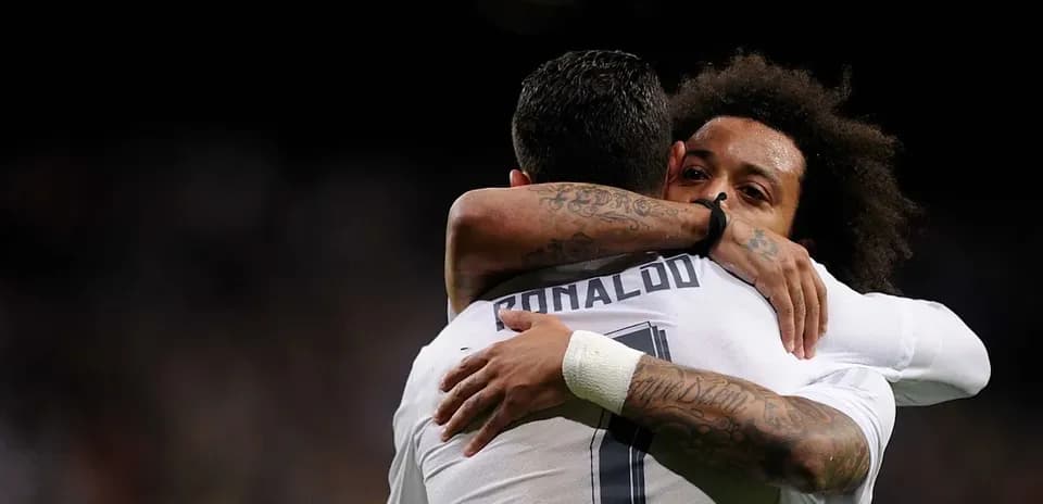 Cristiano Ronaldo and Marcelo embracing after goal