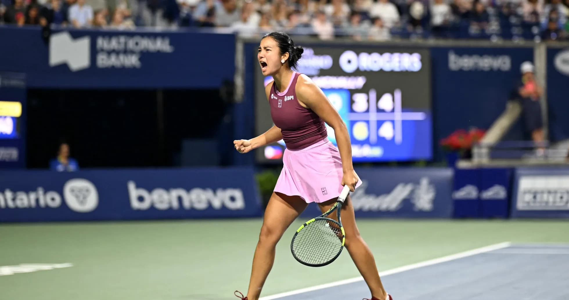 Tennis player celebrating victory on court
