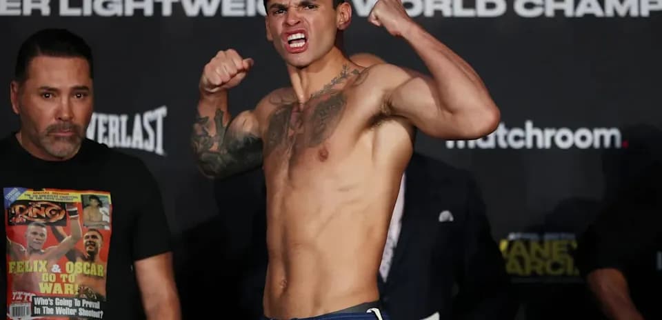 Boxer posing aggressively at weigh-in event