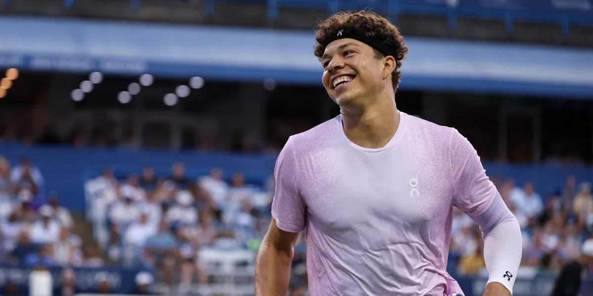 Tennis player smiling during match at stadium
