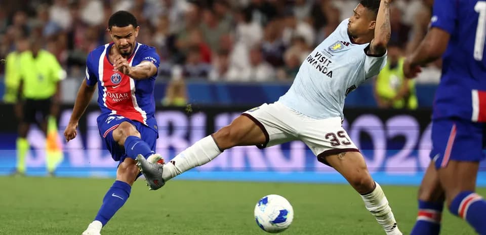 Player striking the ball during a football match