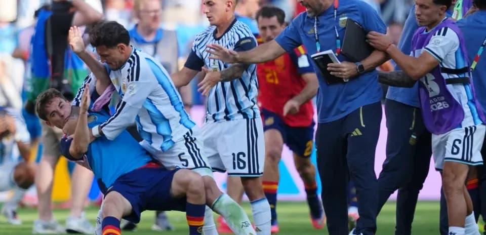Players and staff involved in a scuffle on pitch