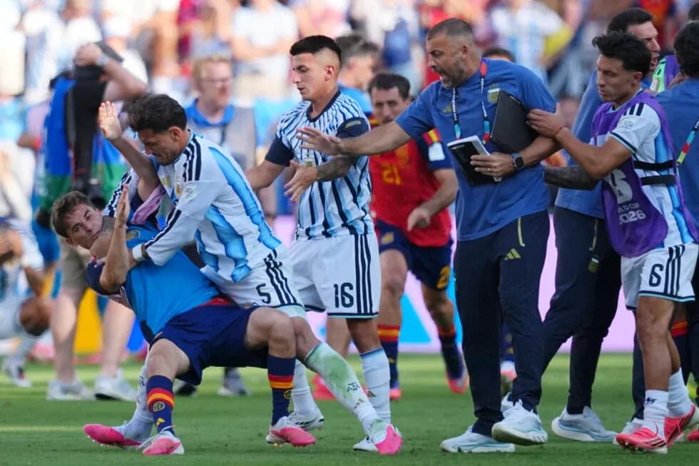 Players and staff involved in a scuffle on pitch