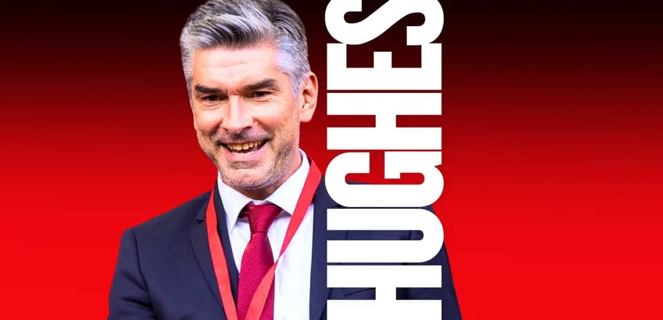 Shirted man smiling with red background