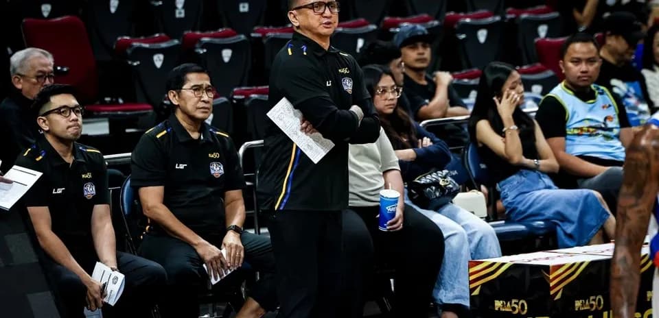 Coaches observing game from the sidelines