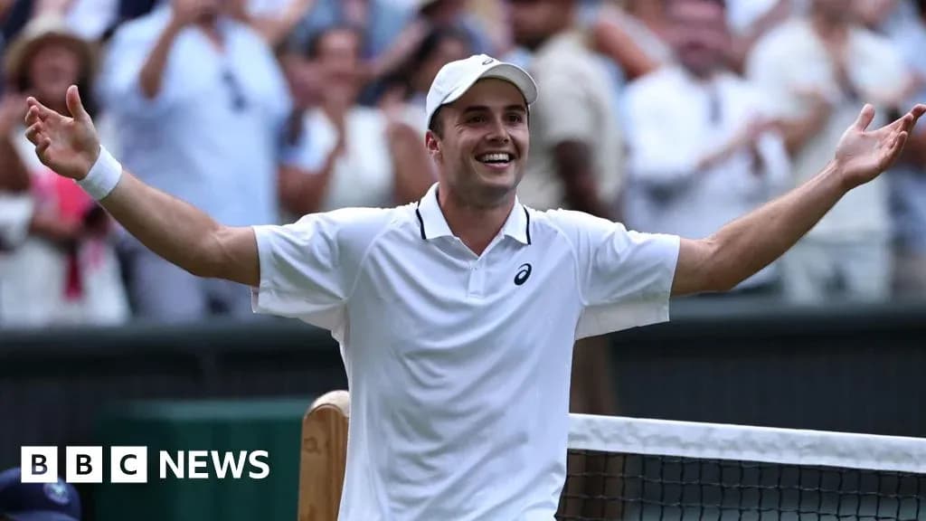 Tennis player celebrating victory at Wimbledon