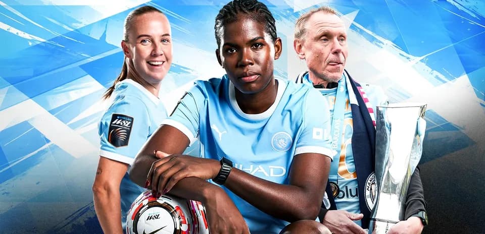 Manchester City players and coach with trophy