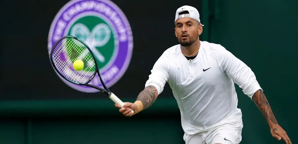 Tennis player hitting a ball at Wimbledon