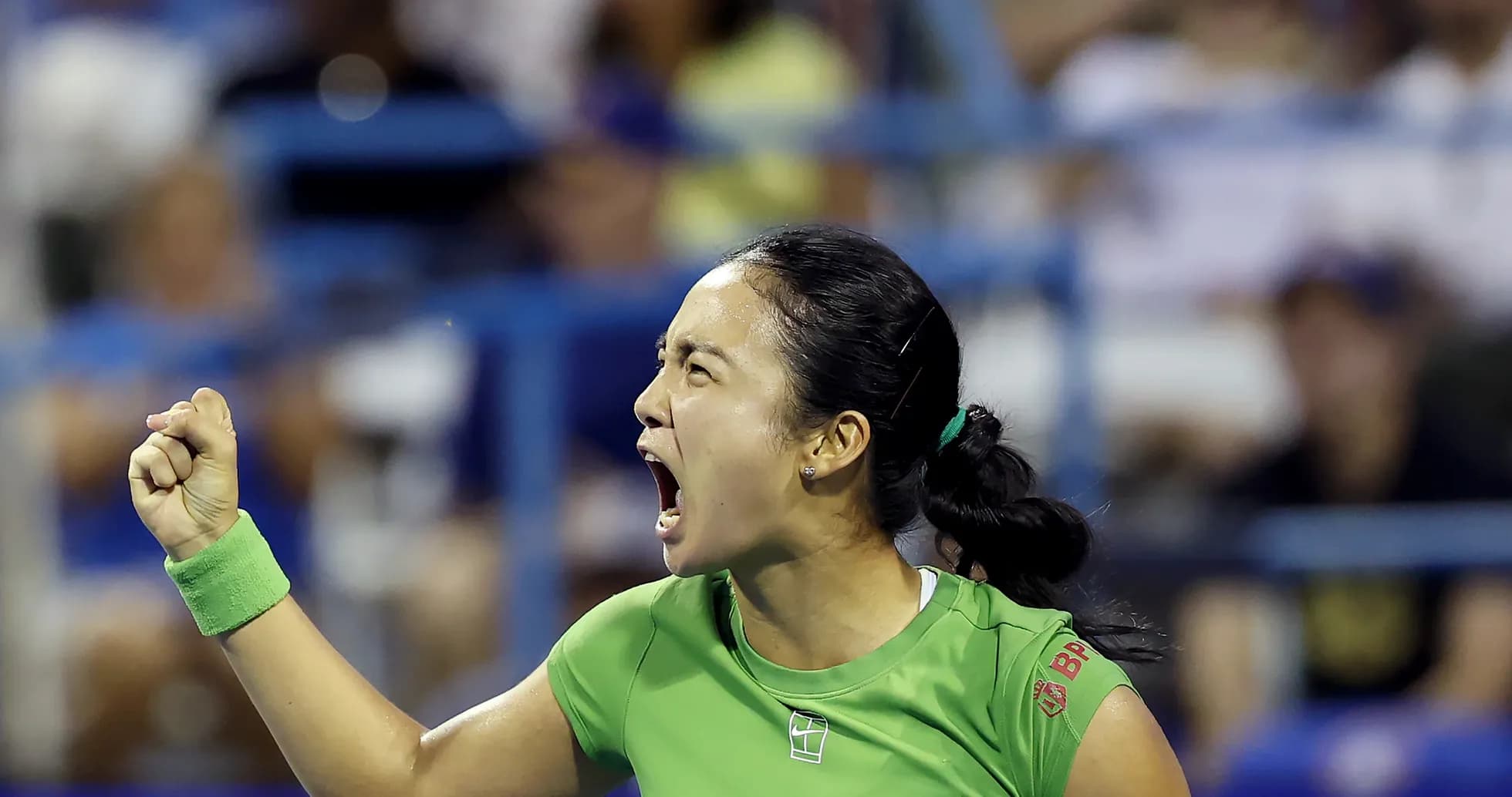 Tennis player celebrating with clenched fist