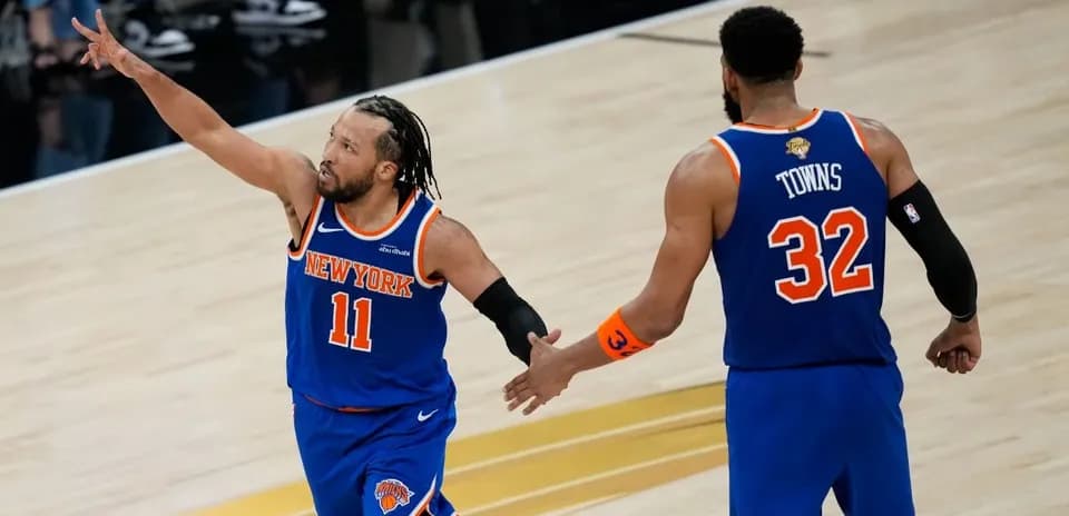 New York Knicks players celebrating during a game