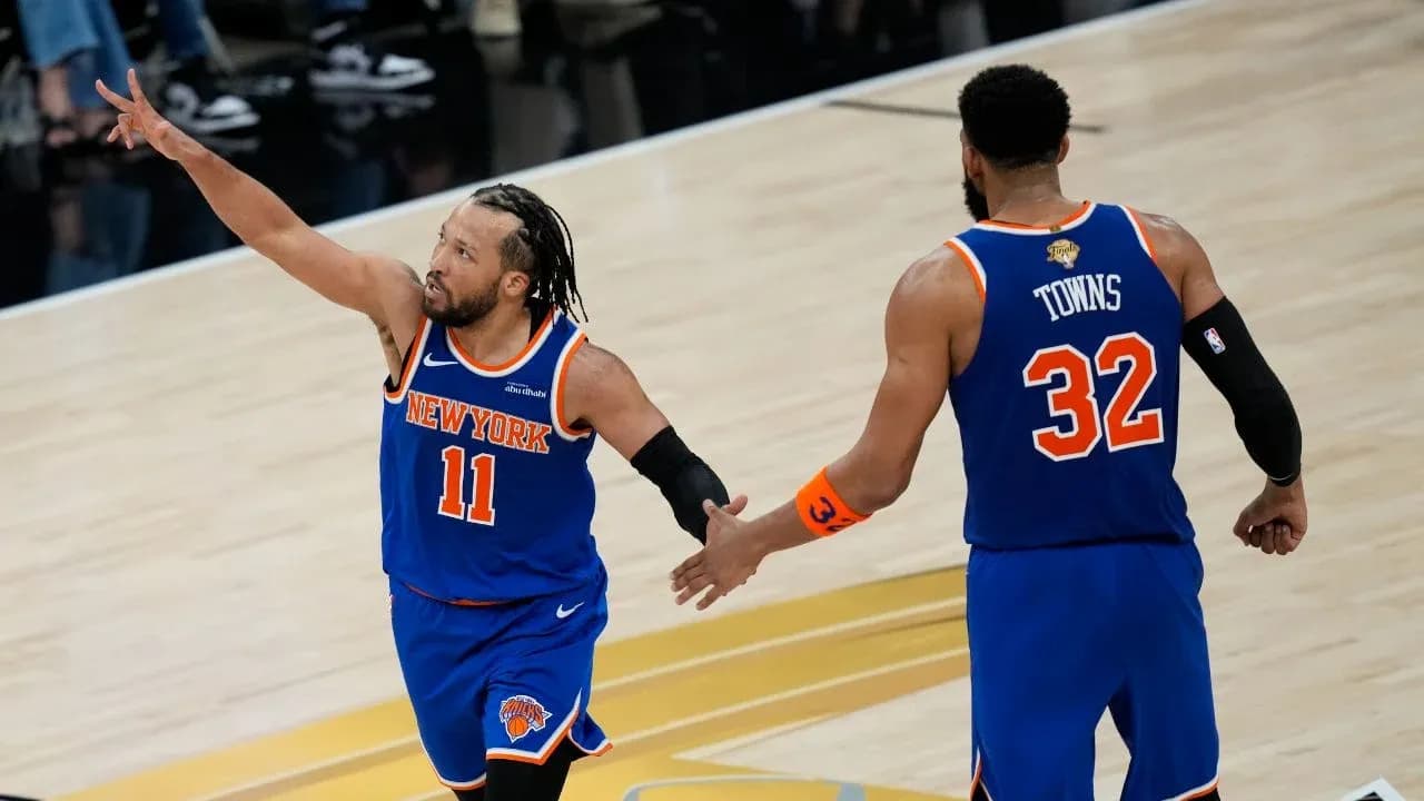 New York Knicks players celebrating during a game