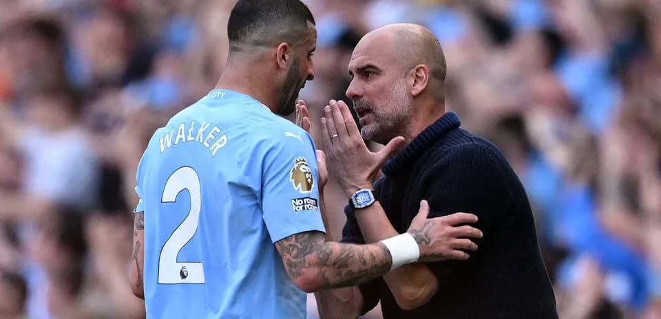 Pep Guardiola speaking with Kyle Walker during match